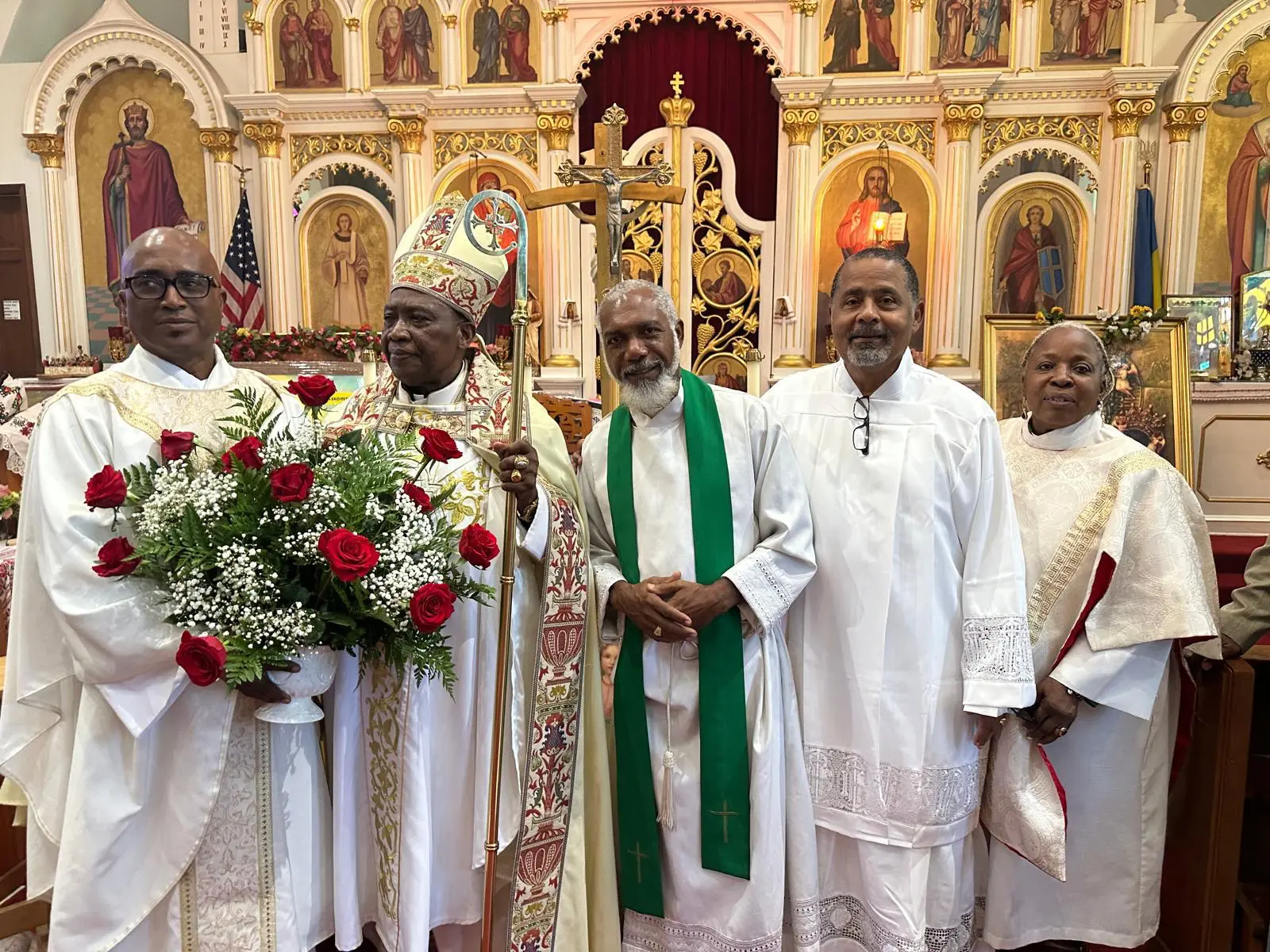 Clergy gathered together in front of the altar