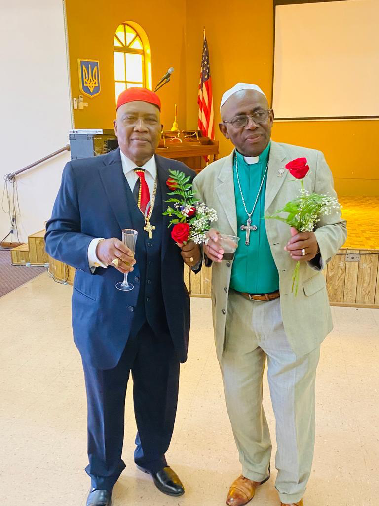 Two members of the clergy celebrating together